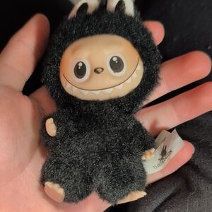 Black Furry Monster Plush Toy by The Noodes